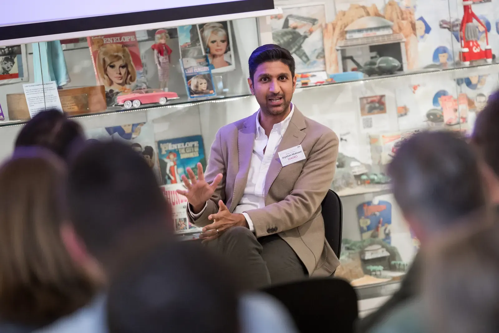 A speaker addressing the room at What’s In-Store 2025